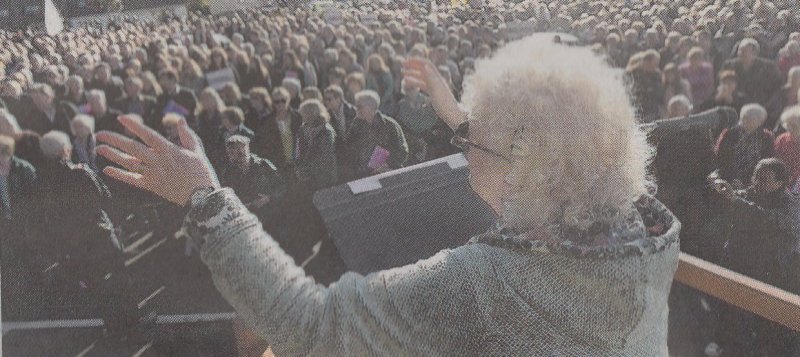 Elizabeth conducting the massed choirs